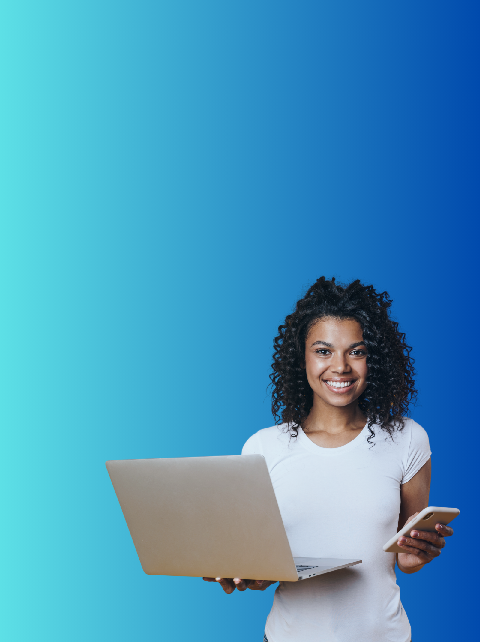 Woman holding a laptop and smartphone against a blue background